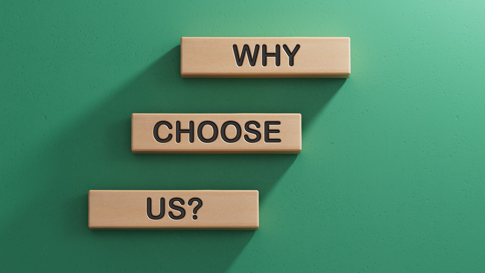 Why choose us symbol. Concept words Why choose us on wooden blocks. Business and Why choose us concept. Copy space.3D rendering on green background.